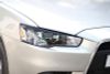 Фото Mitsubishi Lancer X Накладки на передние фары (реснички) компл.- 2шт. REML003200 REML003200 Русская Артель